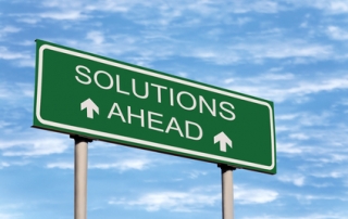 road sign that says solutions ahead